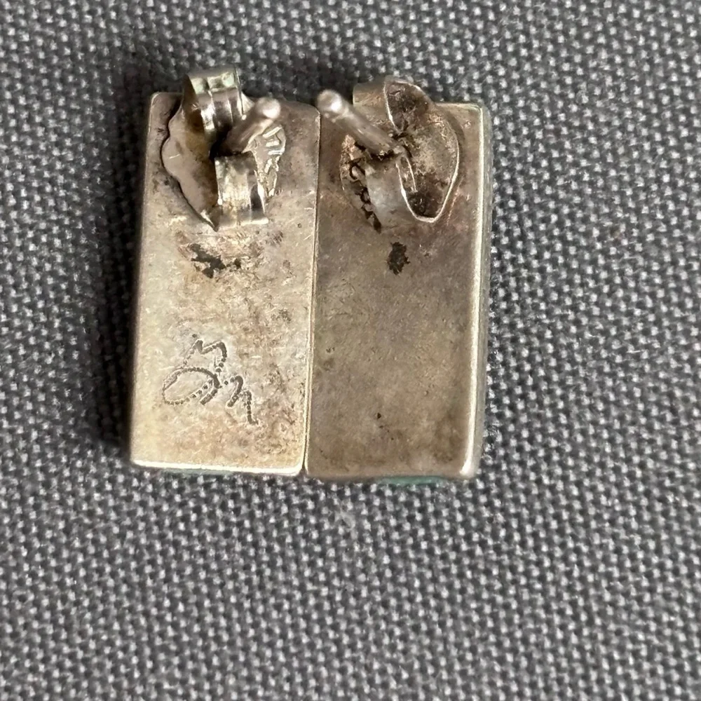 Turquoise and Silver stud earrings 1/2 inch in length signed but not identified